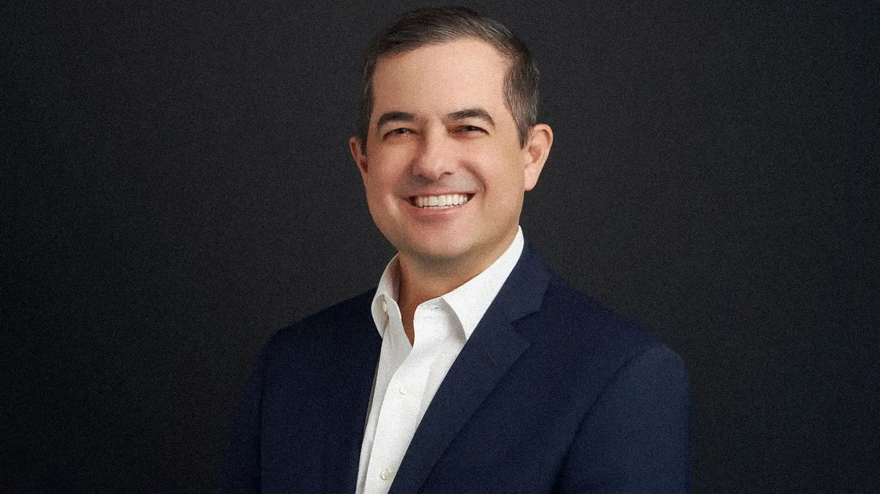 A photographer working with a subject during a timed headshot session in Miami