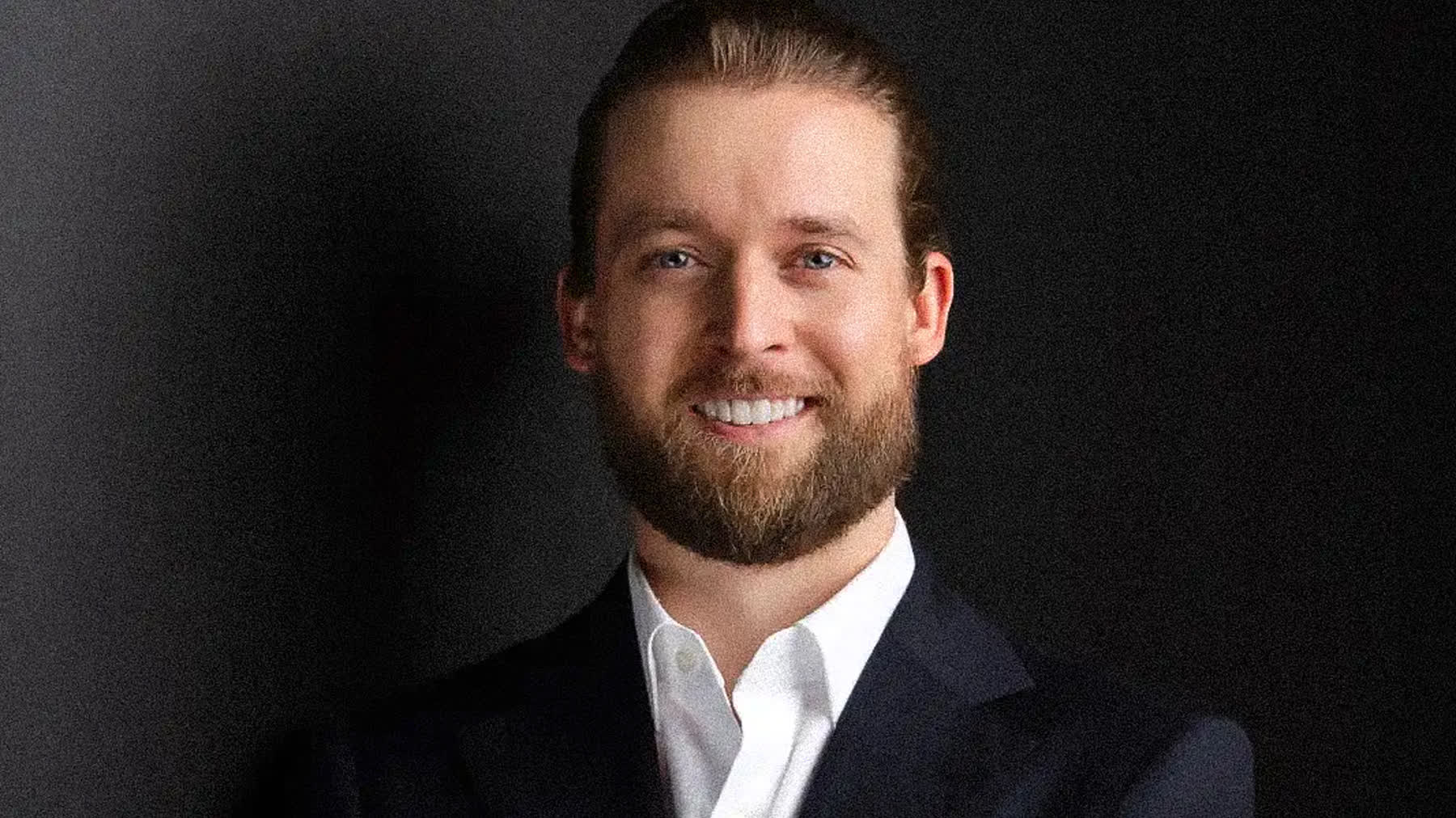 A mortgage broker in business attire photographed for headshots in Miami
