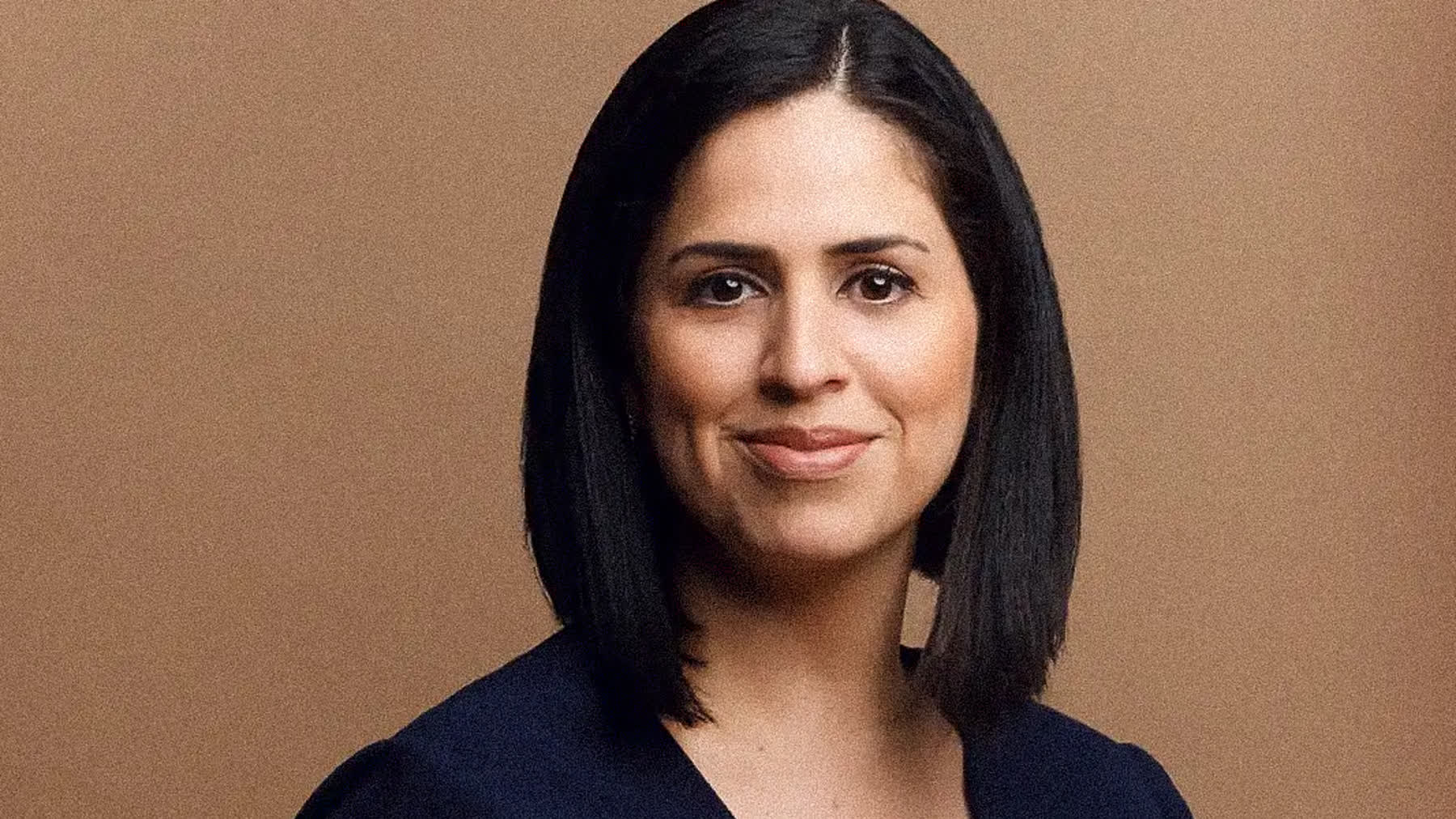 Small business owner photographed for headshots in a Miami studio