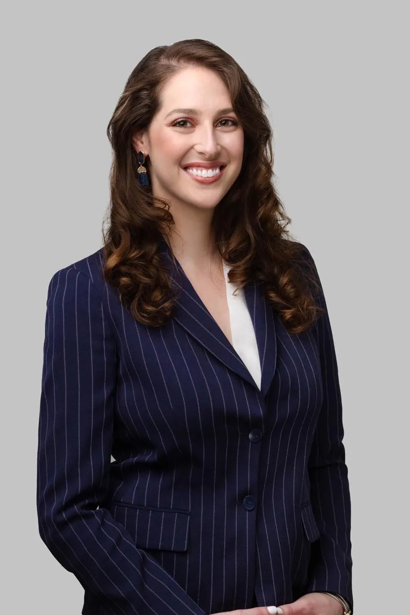 Corporate headshot - professional female in dark pinstripe blazer, Miami